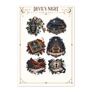 Könnte beinhalten: Ein Aufkleberbogen mit dem Titel Devil's Night Dark & Cozy mit sechs Illustrationen: ein Schlüssel mit The Pope 12, eine Küstenstadt namens Thunder Bay, eine Streichholzschachtel vom 30. Oktober, ein Gebäude namens Meridian City, eine rote Maske und ein herzförmiges Schloss.