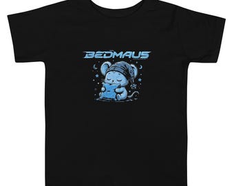 May include: A black short-sleeve t-shirt featuring a graphic of a light blue mouse wearing a nightcap and holding a pillow. Above the mouse, the text BEDMAUS is printed in a stylized light blue font, surrounded by small stars and moons.