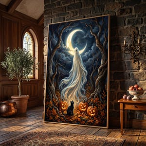 May include: A rectangular wall art print featuring a white ghost floating beneath a crescent moon in a dark forest. Below the ghost, a black cat sits among orange jack-o'-lanterns and fallen autumn leaves on the forest floor.
