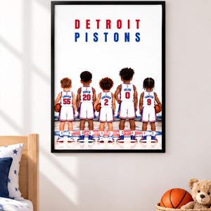 May include: A framed wall art print featuring five children from the back, wearing white Detroit Pistons basketball jerseys with numbers 55, 20, 2, 0, and 9, each holding a basketball on a court with the team logo visible at their feet.