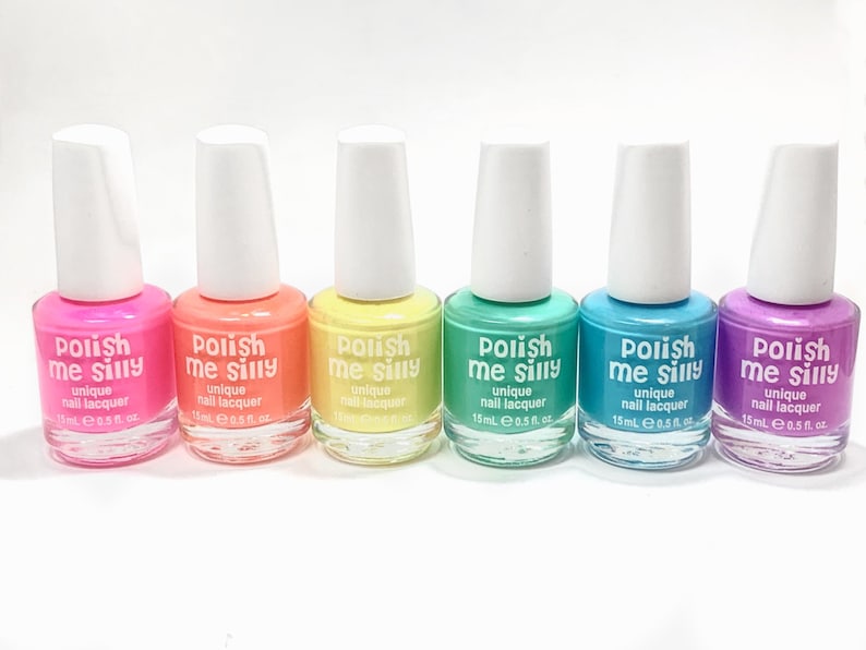 May include: Six bottles of nail polish in various bright colors, including pink, orange, yellow, green, blue, and purple. Each bottle is labeled "Polish Me Silly" with the text "unique nail lacquer" and "15mL e 0.5 fl. oz."