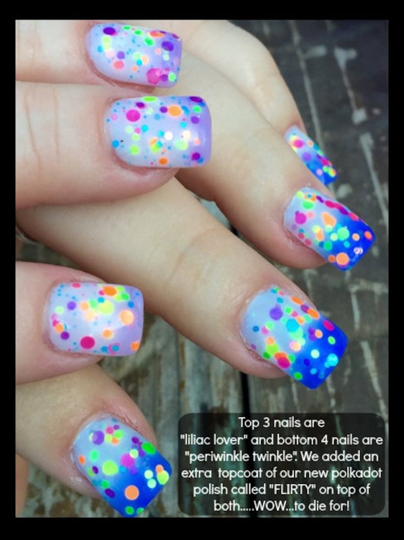 May include: Close-up of fingernails with a light blue base and colorful polka dots. The top three nails have a lilac base and the bottom four nails have a periwinkle base. The text "Top 3 nails are "liliac lover" and bottom 4 nails are "periwinkle twinkle!" We added an extra topcoat of our new polkadot polish called "FLIRTY" on top of both.....WOW...to die for!" is visible at the bottom of the image.