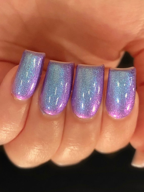 Among all the nail colors purple nails with glitter carry that special vibe  that grants your look that gentle touch …