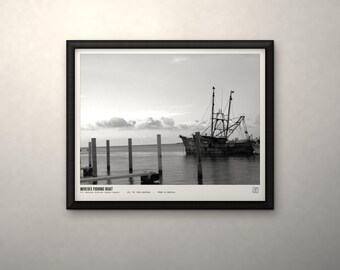 May include: A black and white framed print featuring a fishing boat docked near wooden pilings in calm water. The text at the bottom reads WOE163 FISHING BOAT, U.S. National Archives (Public Domain), ACC. NO. 0863-6405000, PRINT IS ARCHIVAL.