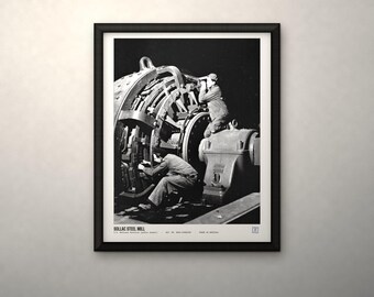 May include: A black and white framed photograph depicting two workers operating large industrial machinery at the Sollac Steel Mill. The print features the text SOLLAC STEEL MILL, U.S. National Archives (public domain), and other small text at the bottom.