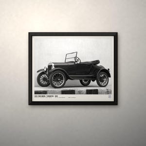 May include: A black and white framed print featuring a side profile of a 1926 Ford Model T Roadster. The text at the bottom reads 1926 FORD MODEL T ROADSTER 1926. The vintage automobile is depicted with spoked wheels, a folding windshield, and an open-top body style, presented within a simple black frame.