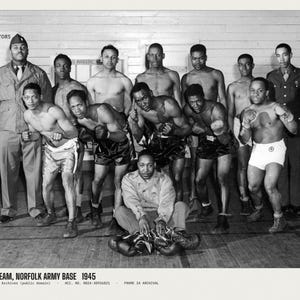 May include: A black and white photograph of a boxing team at the Norfolk Army Base in 1945. The group includes several boxers in trunks and gloves, and two individuals in military uniforms. The text reads: BOXING TEAM, NORFOLK ARMY BASE 1945.
