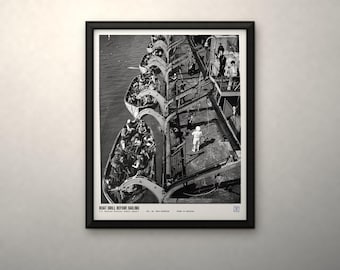 May include: A black and white framed print featuring an overhead view of a boat drill on a ship deck with lifeboats filled with people. The text at the bottom reads BOAT DRILL BEFORE SAILING, U.S. National Archives (1942), 80-G-3864-808038, FROM US ARCHIVES.