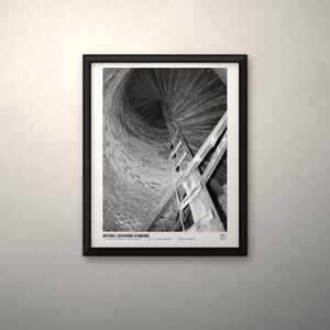 May include: A black and white framed print featuring a low-angle view of a historic lighthouse staircase spiraling upward inside a stone tower. The text at the bottom reads HISTORIC LIGHTHOUSE STAIRCASE, U.S. NATIONAL ARCHIVES, PUBLIC DOMAIN, NO. 80-G-470988, IMAGE IS ARCHIVAL.