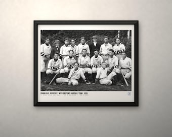 May include: A black and white framed photograph of the 1899 Groton baseball team, including Franklin D. Roosevelt. The team members wear vintage uniforms with striped sleeves. The text at the bottom reads: FRANKLIN D. ROOSEVELT WITH GROTON'S BASEBALL TEAM 1899.