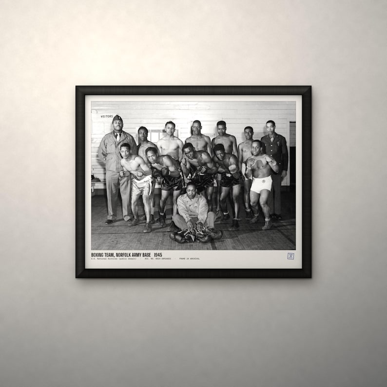 May include: A black and white framed photograph of the 1945 Norfolk Army Base boxing team. The image shows a group of men in boxing attire and military uniforms, with text at the bottom reading: BOXING TEAM, NORFOLK ARMY BASE 1945.