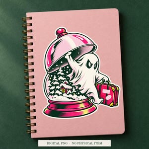 Haunted Snow Globe Escape artwork decorating a notebook as a white outlined sticker. Digital PNG project example; notebook and sticker are not included.