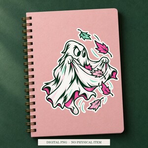 Ghost Autumn Collector artwork decorating a notebook as a white outlined sticker. Digital PNG project example; notebook and sticker are not included.