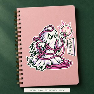 Haunted Extension Cord artwork decorating a notebook as a white outlined sticker. Digital PNG project example; notebook and sticker are not included.