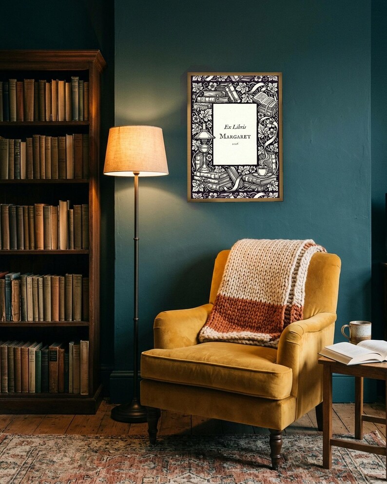 Personalised ex libris bookplate print in engraved ink on cream: a border of stacked books, a reading lamp and a cup of tea, with Ex Libris above and a mum's name and a year set in the centre.