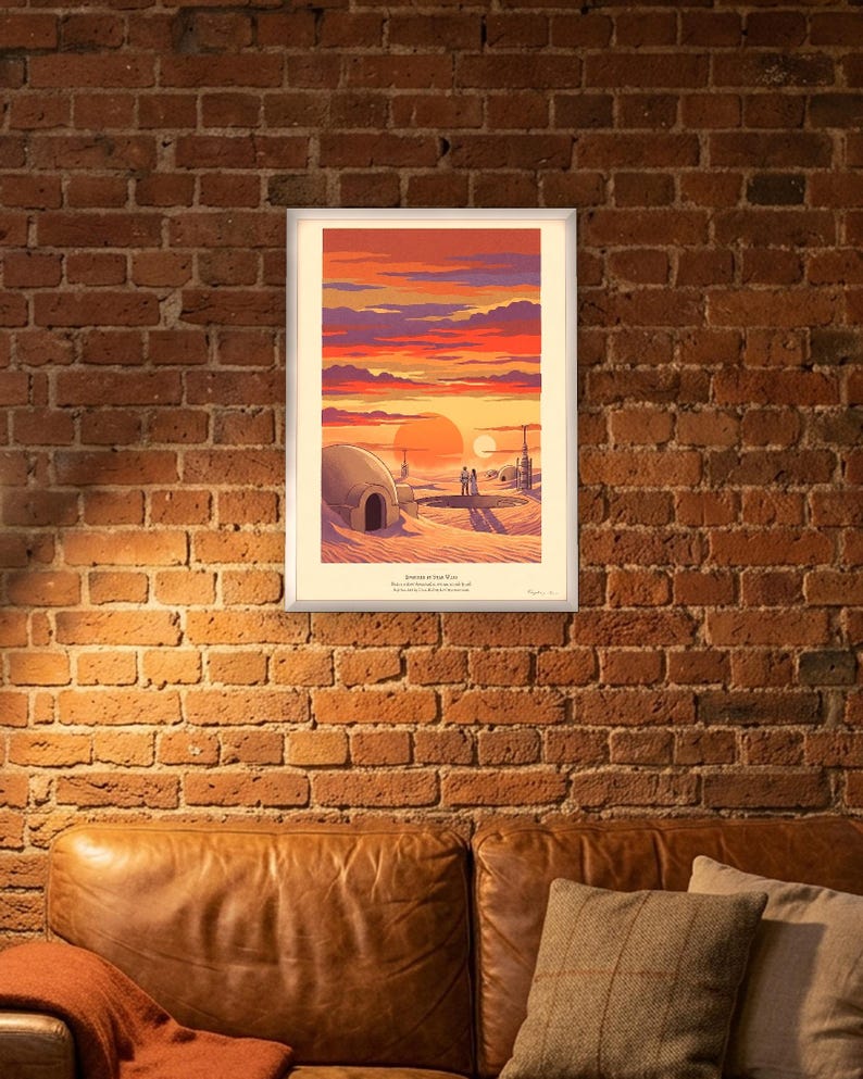Twin suns sci fi art print in French colour lithograph style: two figures watch twin suns set over a desert homestead of domes and water towers at dusk. Shown framed in black, white or natural oak and unframed, with the style reference and behind-the-scenes shots.