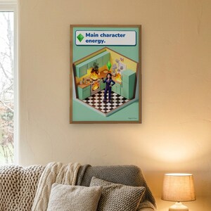 Main character energy funny kitchen print in bright life-sim game style: a calm woman in navy pyjamas holds a glass of red wine while her mint and lemon kitchen burns around her. Shown framed in black, white or natural oak and unframed, with behind-the-scenes shots.