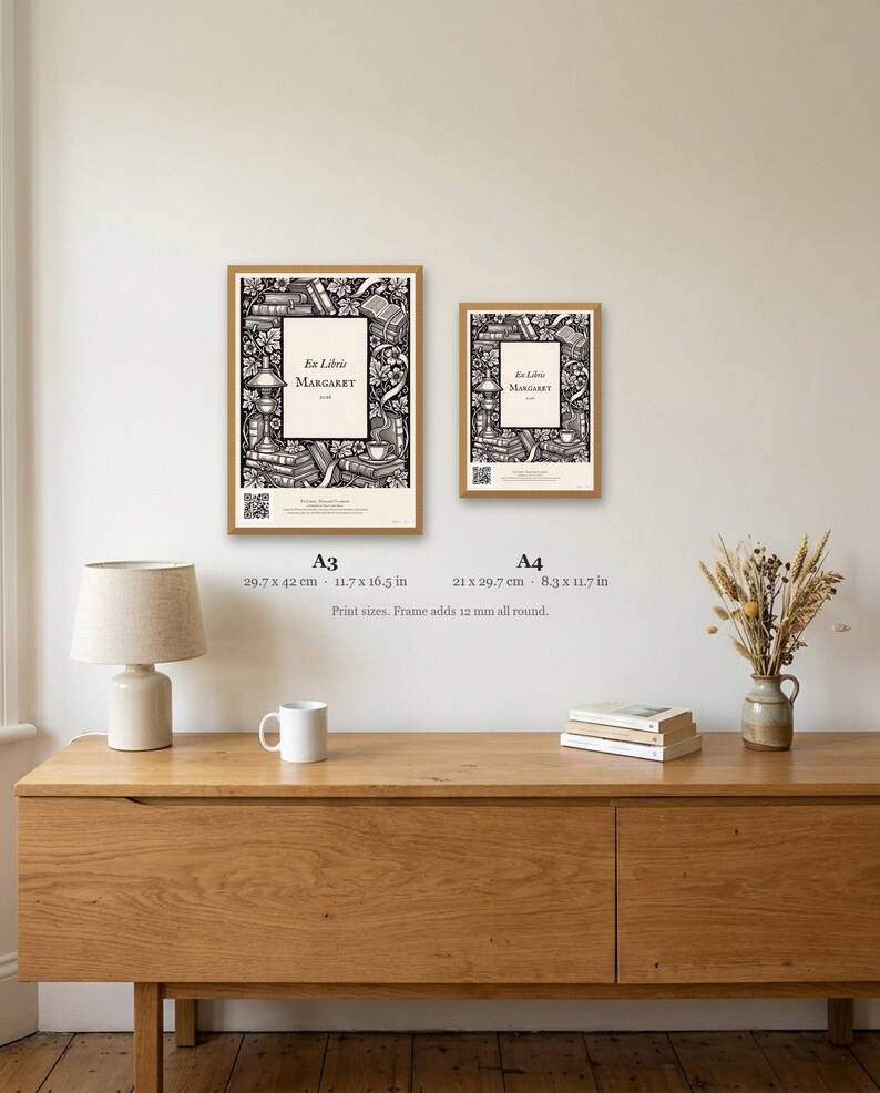 Personalised ex libris bookplate print in engraved ink on cream: a border of stacked books, a reading lamp and a cup of tea, with Ex Libris above and a mum's name and a year set in the centre.