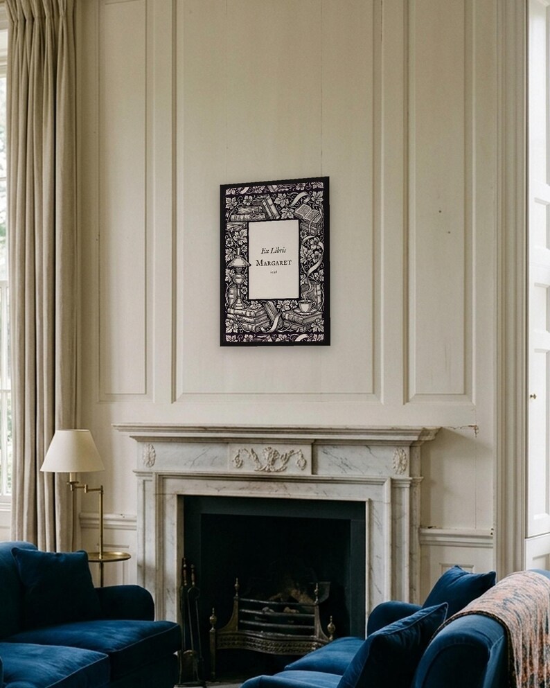 Personalised ex libris bookplate print in engraved ink on cream: a border of stacked books, a reading lamp and a cup of tea, with Ex Libris above and a mum's name and a year set in the centre.