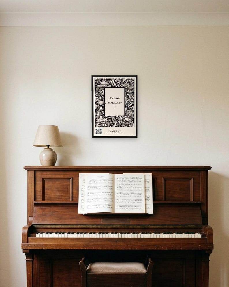 Personalised ex libris bookplate print in engraved ink on cream: a border of stacked books, a reading lamp and a cup of tea, with Ex Libris above and a mum's name and a year set in the centre.