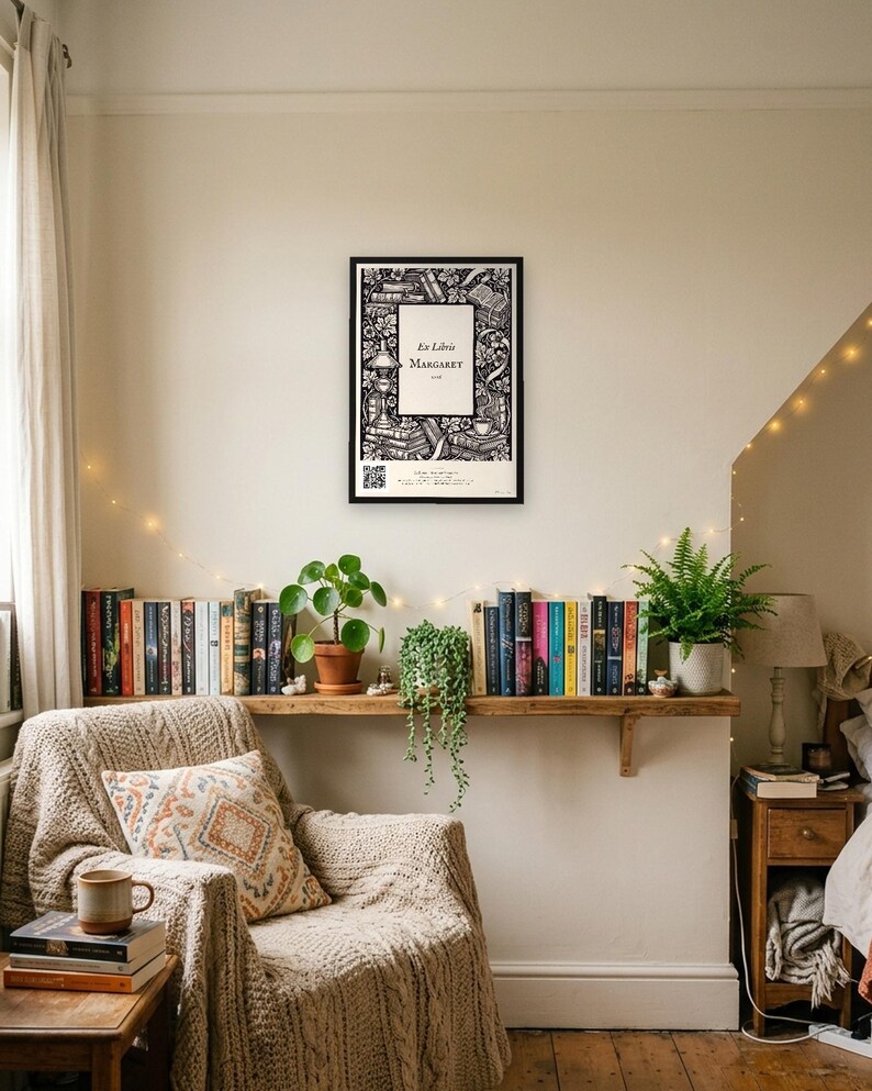 Personalised ex libris bookplate print in engraved ink on cream: a border of stacked books, a reading lamp and a cup of tea, with Ex Libris above and a mum's name and a year set in the centre.