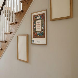 Personalised reading corner bookplate print in engraved ink on cream: a border of stacked books, a reading lamp and an open window, with Ex Libris above and a teacher's name and class year set in the centre.