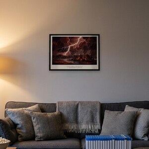 Blood Meridian art print in 1930s Southwest desert painting style: a pale figure stands on the roof of a ruined adobe with arms raised to the lightning, men round a fire in the doorway below, rain over the desert. Shown framed in black, white or natural oak and unframed, with the style reference and behind-the-scenes shots.