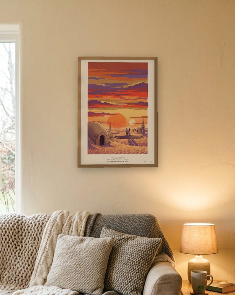 Twin suns sci fi art print in French colour lithograph style: two figures watch twin suns set over a desert homestead of domes and water towers at dusk. Shown framed in black, white or natural oak and unframed, with the style reference and behind-the-scenes shots.