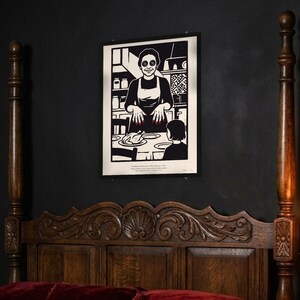 Coraline inspired art print in black woodcut style: the Other Mother with black button eyes and red fingernails smiles over a roast chicken as Coraline, seen from behind, sits at the table. Shown framed in black, white or natural oak and unframed, with the style reference and behind-the-scenes shots.