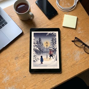 Narnia inspired art print in Japanese snow woodblock style: a girl in a blue coat finds a glowing lamp-post in a snowy wood at night as a faun with an umbrella and parcels hurries towards her. Shown framed in black, white or natural oak and unframed, with the style reference and behind-the-scenes shots.