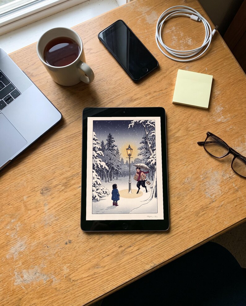 Narnia inspired art print in Japanese snow woodblock style: a girl in a blue coat finds a glowing lamp-post in a snowy wood at night as a faun with an umbrella and parcels hurries towards her. Shown framed in black, white or natural oak and unframed, with the style reference and behind-the-scenes shots.