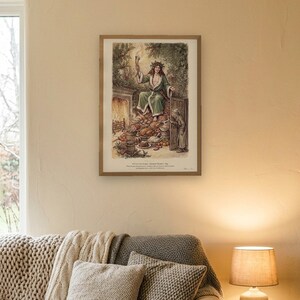 A Christmas Carol art print in Edwardian ink and watercolour style: the Ghost of Christmas Present in a green fur-trimmed robe and holly crown sits on a heap of Christmas food as Scrooge peers round the door. Shown framed in black, white or natural oak and unframed, with the style reference and behind-the-scenes shots.