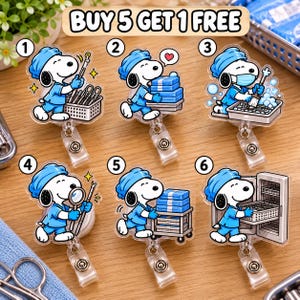 May include: Six acrylic badge reels featuring Snoopy dressed in blue medical scrubs and a surgical cap. Each reel shows Snoopy performing different tasks like holding instruments, carrying blue supply boxes, or cleaning tools. Text reads BUY 5 GET 1 FREE.