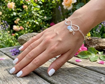 Pulsera Cruz Infinita: Plata de ley, disco con inicial y perla