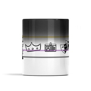 May include: A cylindrical ceramic mug featuring a horizontal gradient from black at the top to white at the bottom. The design includes thin horizontal stripes in gold, purple, and gray, with black line art icons of a crown, an ID badge, and theater masks.