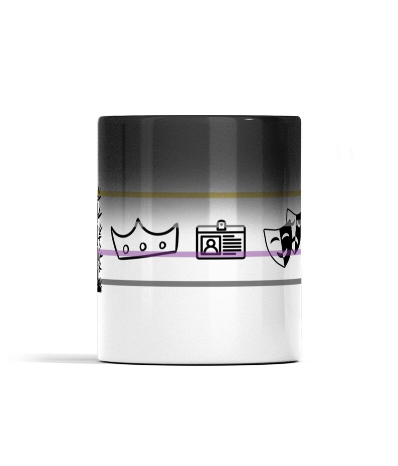 May include: A cylindrical ceramic mug featuring a horizontal gradient from black at the top to white at the bottom. The design includes thin horizontal stripes in gold, purple, and gray, with black line art icons of a crown, an ID badge, and theater masks.