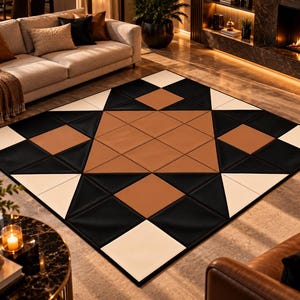 May include: A rectangular area rug featuring a geometric pattern composed of black, white, and tan squares and triangles. The design displays a large central star motif created by the arrangement of these colored shapes across the surface.