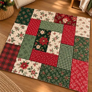 May include: A square quilted fabric mat featuring a patchwork design of various holiday-themed patterns. The fabric blocks include red and green poinsettias, holly leaves, red plaid, green gingham, and small white dots on a red background.