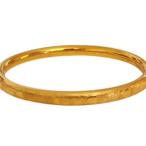 May include: A set of three ceramic mugs with a speckled, matte finish. The mugs are in shades of cream, light brown, and dark brown. Each mug has a simple, minimalist design, perfect for coffee or tea.