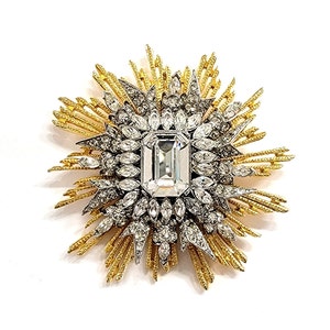Broche/prendedor con sol y cristales dorados de Kenneth Lane