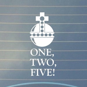 May include: White decal featuring a stylized orb with a cross on top and the text "ONE, TWO, FIVE!". The design is simple and bold, suitable for application on a car window or similar surface.
