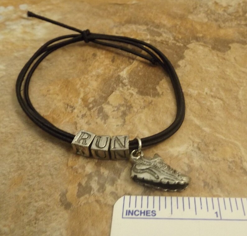 Black Stretch Cord Bracelet with Pewter Letters that say Etsy