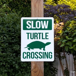 Señal de cruce de tortugas Señal de advertencia de tráfico lento