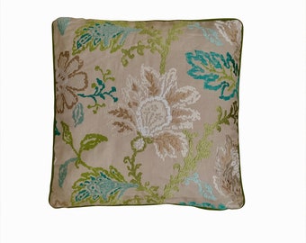 Nina Campbell - green, aqua and white floral embroidery on beige linen ground