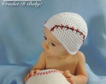 May include: A white crocheted baby hat with red and black stitching, resembling a baseball stitch. The hat is worn by a baby holding a white baseball.