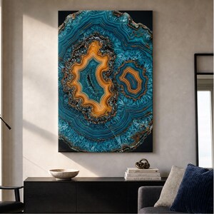May include: A rectangular wall art print featuring a large, detailed agate stone pattern. The design displays concentric rings of deep teal, turquoise, and vibrant orange, with dark, crystalline textures at the centre of the stone formations.