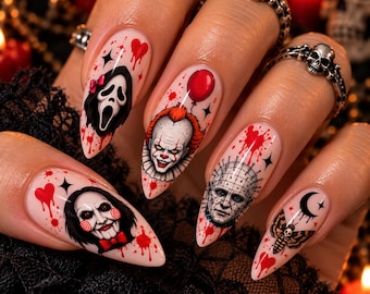 May include: Almond-shaped press-on nails featuring detailed horror movie character illustrations including a ghost mask, a clown with a red balloon, a ventriloquist doll, a pinhead figure, and a moth, accented with red blood splatters and hearts.