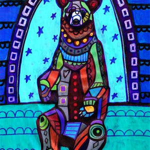 May include: A colorful painting of a bear sitting upright, decorated with intricate geometric patterns in shades of blue, green, red, and purple. The bear is framed by an arched border against a starry background with a scalloped base.