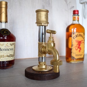 Industrial bourbon dispenser, Pipe alcohol dispenser.