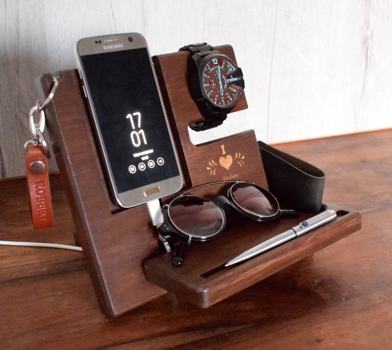 May include: Wooden organiser with slots for a phone, watch, sunglasses, and a pen. The organiser has a personalised inscription that says "I love you" with a heart.